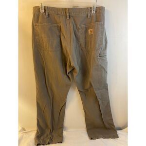 Carhartt  khaki colored denim pants 36x30” distressed tear on pocket